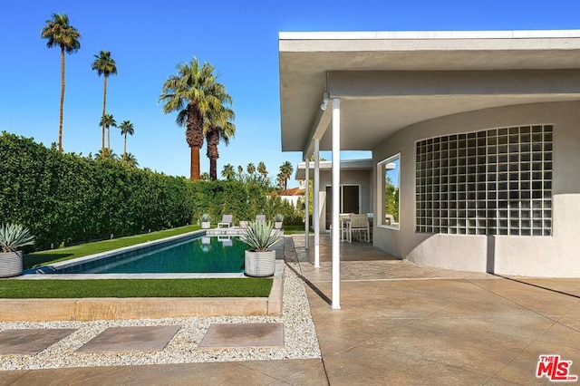 view of pool featuring a patio area