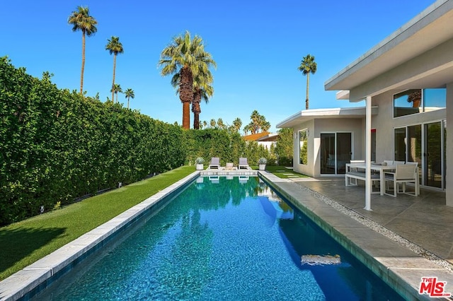 view of pool with a patio