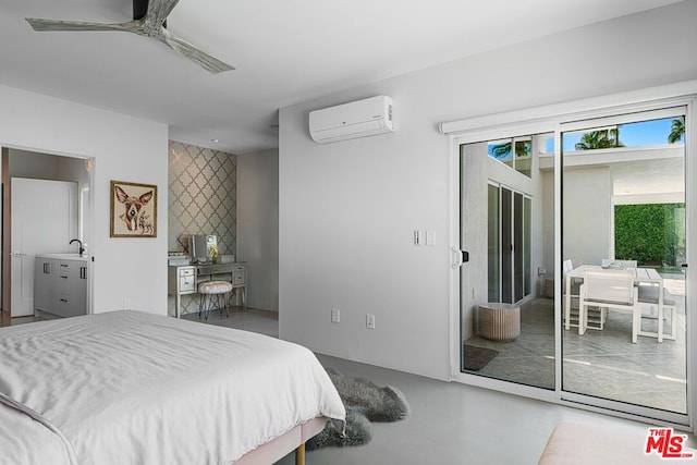 bedroom with access to outside, sink, ceiling fan, concrete flooring, and a wall unit AC