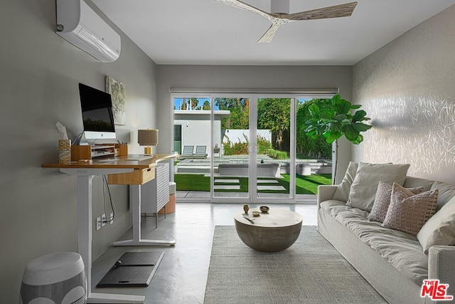 living room featuring an AC wall unit and concrete floors