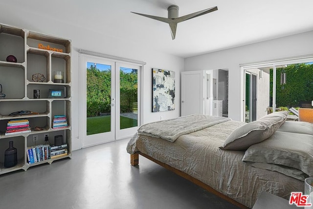 bedroom with access to outside, ceiling fan, french doors, and concrete flooring