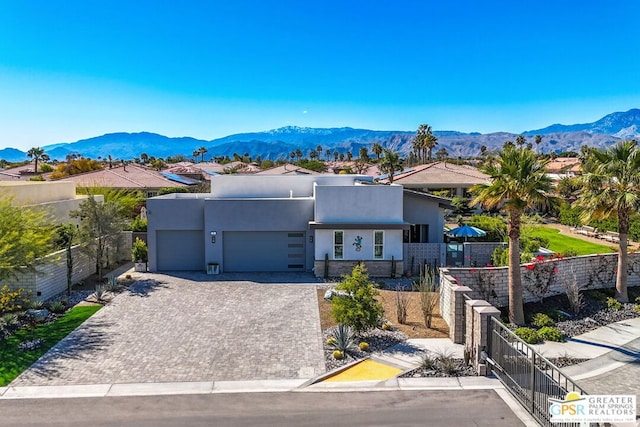 view of front of home featuring a mountain view and a garage