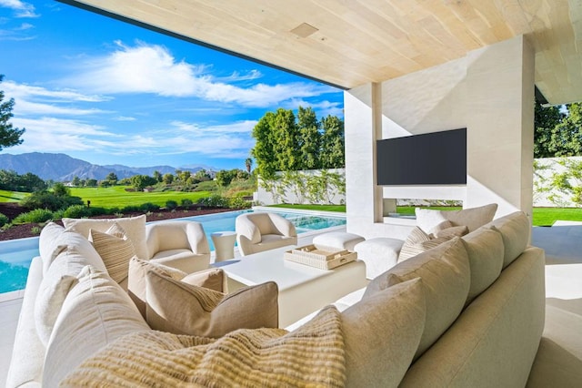 view of patio with a mountain view and an outdoor hangout area