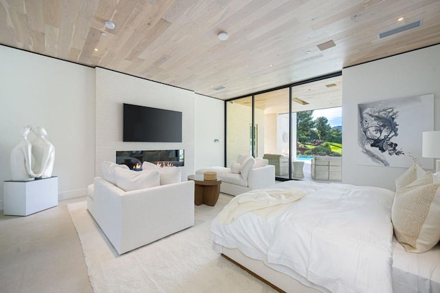 bedroom with floor to ceiling windows and wooden ceiling