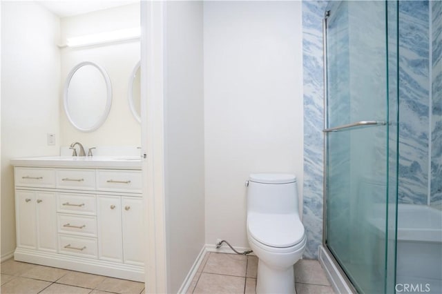 bathroom featuring tile patterned flooring, vanity, toilet, and a shower with shower door