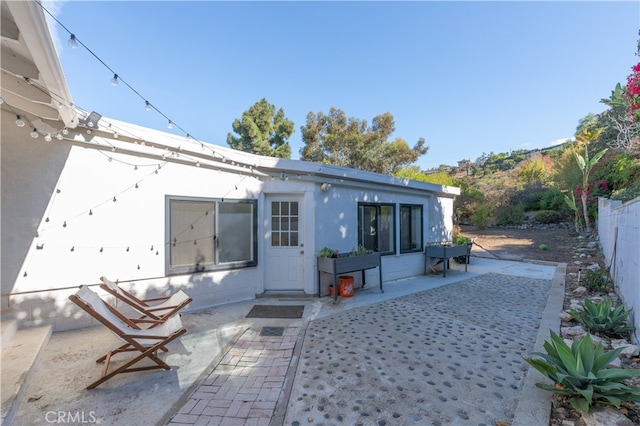 back of property featuring a patio area