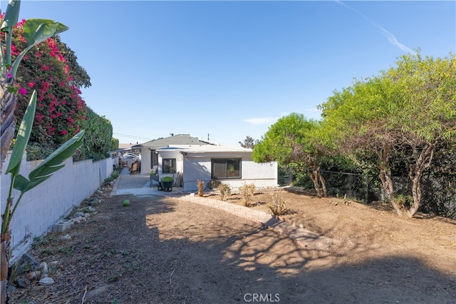 back of property featuring a patio area