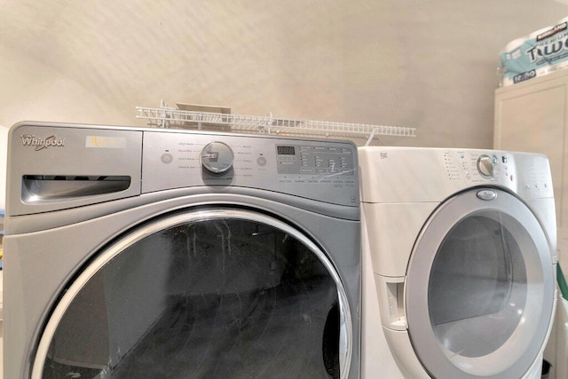 washroom featuring washer and dryer