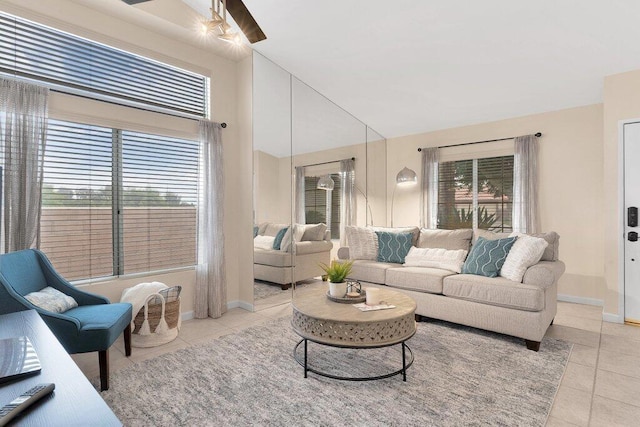 living room featuring ceiling fan and light tile patterned flooring