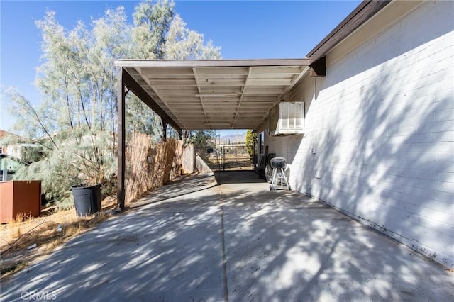 view of parking / parking lot featuring a carport