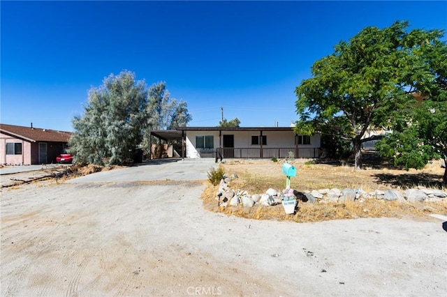 ranch-style house with a carport