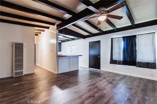 unfurnished living room with lofted ceiling with beams, dark hardwood / wood-style floors, and ceiling fan