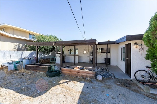 rear view of house with a patio