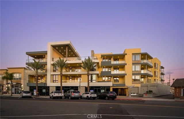 view of outdoor building at dusk