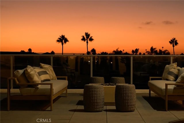 view of patio terrace at dusk