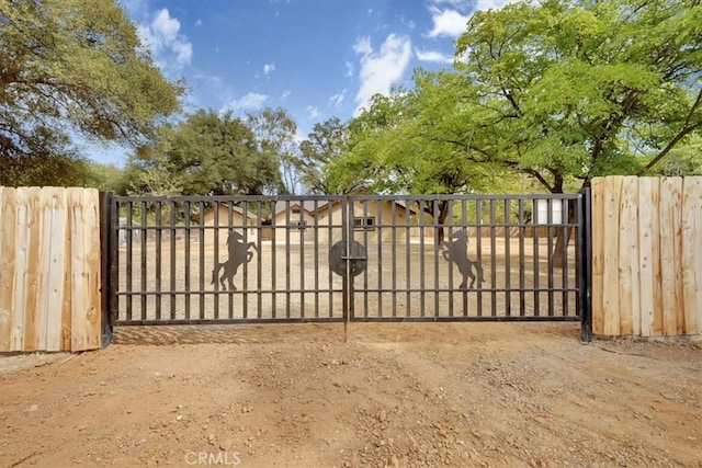 view of gate featuring fence