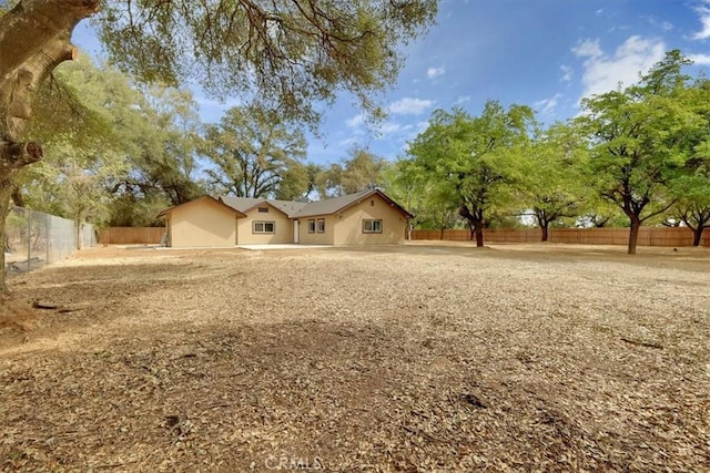 ranch-style home featuring a fenced backyard