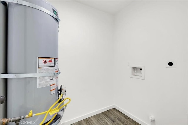 utility room featuring strapped water heater