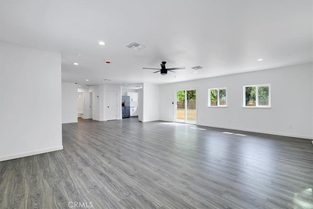 unfurnished living room featuring baseboards, visible vents, ceiling fan, dark wood-style flooring, and recessed lighting