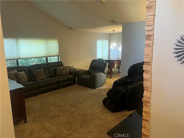 living room featuring carpet floors and lofted ceiling