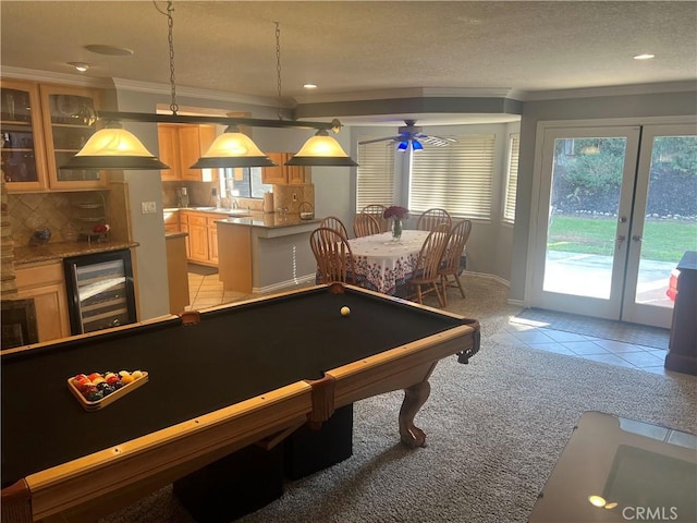 rec room featuring french doors, crown molding, billiards, wine cooler, and light tile patterned floors