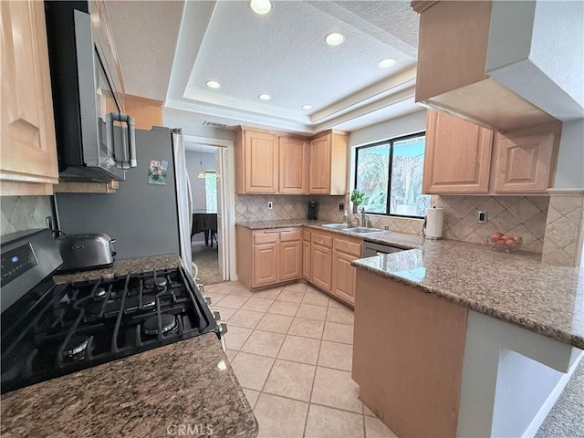 1732 Winston Ave, Upland, CA 91784 - kitchen featuring gas stove, light brown cabinets, a textured ceiling, a tray ceiling, and a sink