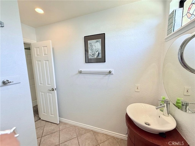 1732 Winston Ave, Upland, CA 91784 - bathroom with tile patterned flooring, baseboards, and vanity