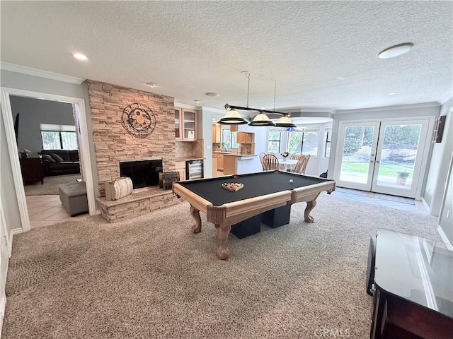 1732 Winston Ave, Upland, CA 91784 - game room with crown molding, light colored carpet, a stone fireplace, healthy amount of natural light, and billiards