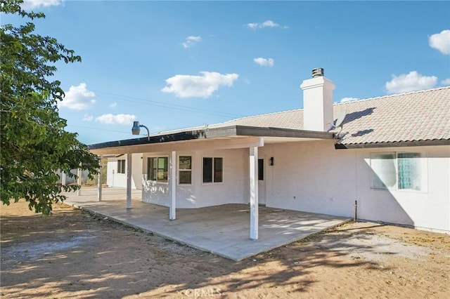 back of property with a patio area