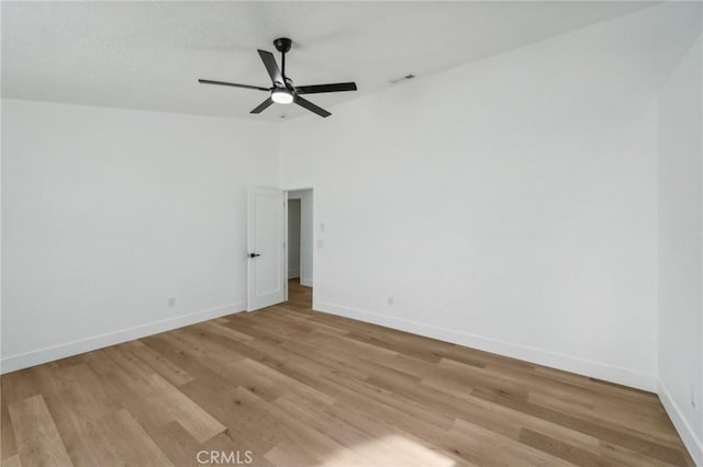 spare room featuring ceiling fan and light hardwood / wood-style floors