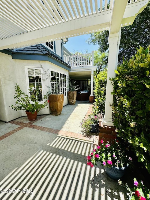 view of patio / terrace with a balcony