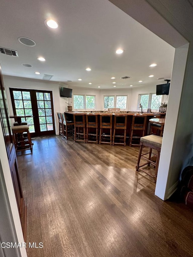 miscellaneous room featuring dark hardwood / wood-style flooring and french doors