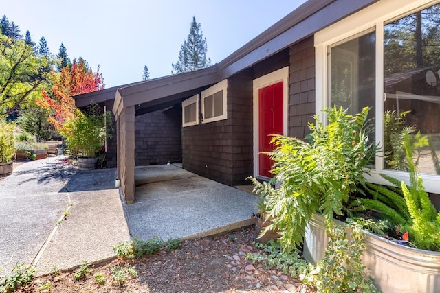 view of property exterior featuring a patio area