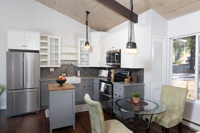 kitchen featuring gray cabinets, white cabinetry, stainless steel appliances, and decorative light fixtures