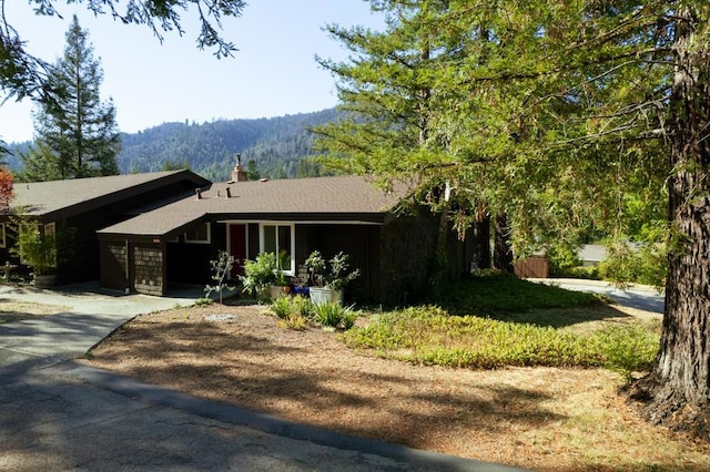 view of front of house featuring a mountain view and a garage