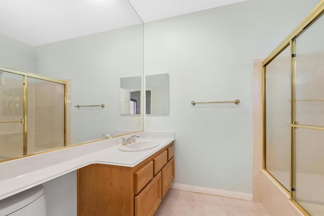 full bathroom featuring vanity, toilet, and combined bath / shower with glass door