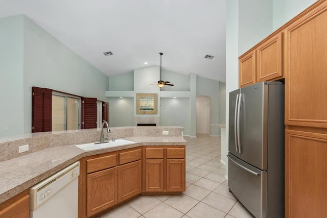 kitchen with stainless steel fridge, white dishwasher, ceiling fan, sink, and light tile patterned flooring