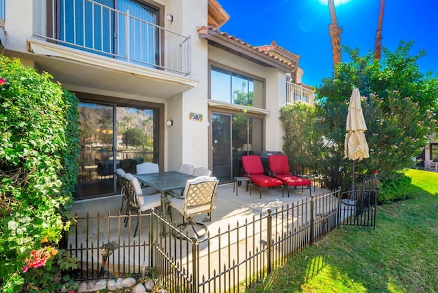 view of patio / terrace with a balcony and an outdoor hangout area