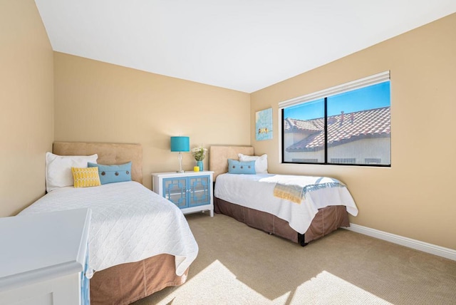 bedroom featuring light colored carpet