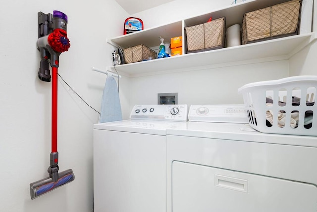 clothes washing area featuring separate washer and dryer