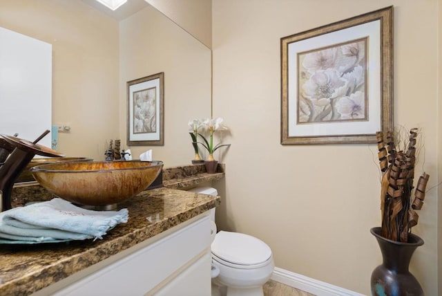 bathroom with vanity and toilet