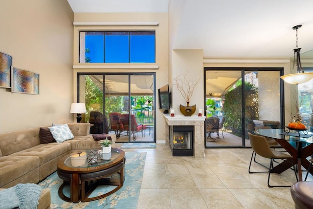 living room featuring light tile patterned floors and a healthy amount of sunlight