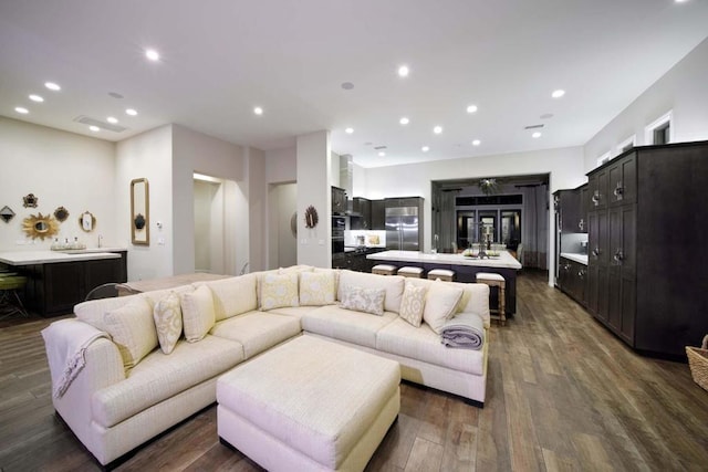 living room featuring dark wood-type flooring