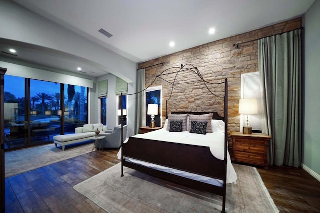 bedroom with dark wood-type flooring