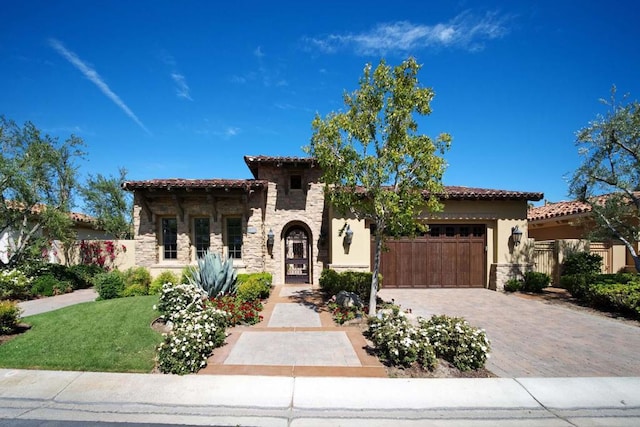 mediterranean / spanish-style house featuring a garage