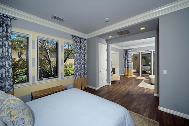 bedroom with crown molding and dark hardwood / wood-style flooring