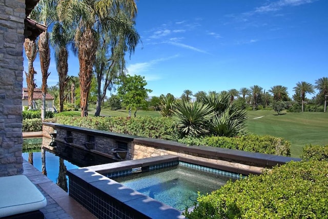 view of pool featuring an in ground hot tub