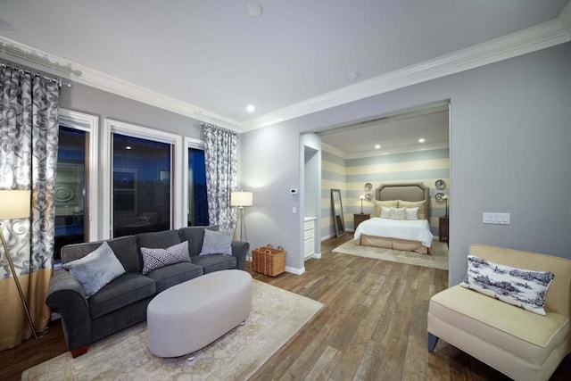 bedroom with hardwood / wood-style floors and crown molding