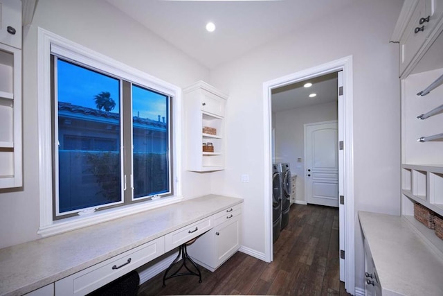 interior space featuring washing machine and dryer and dark wood-type flooring