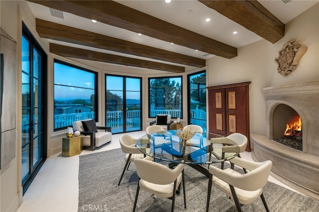 interior space featuring beamed ceiling and a premium fireplace